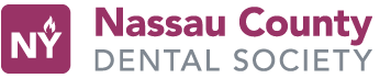 The image shows a logo with text that reads NASAU COUNTY DENTAL SOCIETY, accompanied by a graphic of a toothbrush and a crown, suggesting an association with dental care and possibly a professional organization.